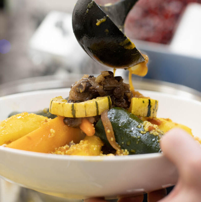 Moroccan roasted vegetables—eggplant, zucchini, and peppers—in a clay bowl. chefmoulay.org